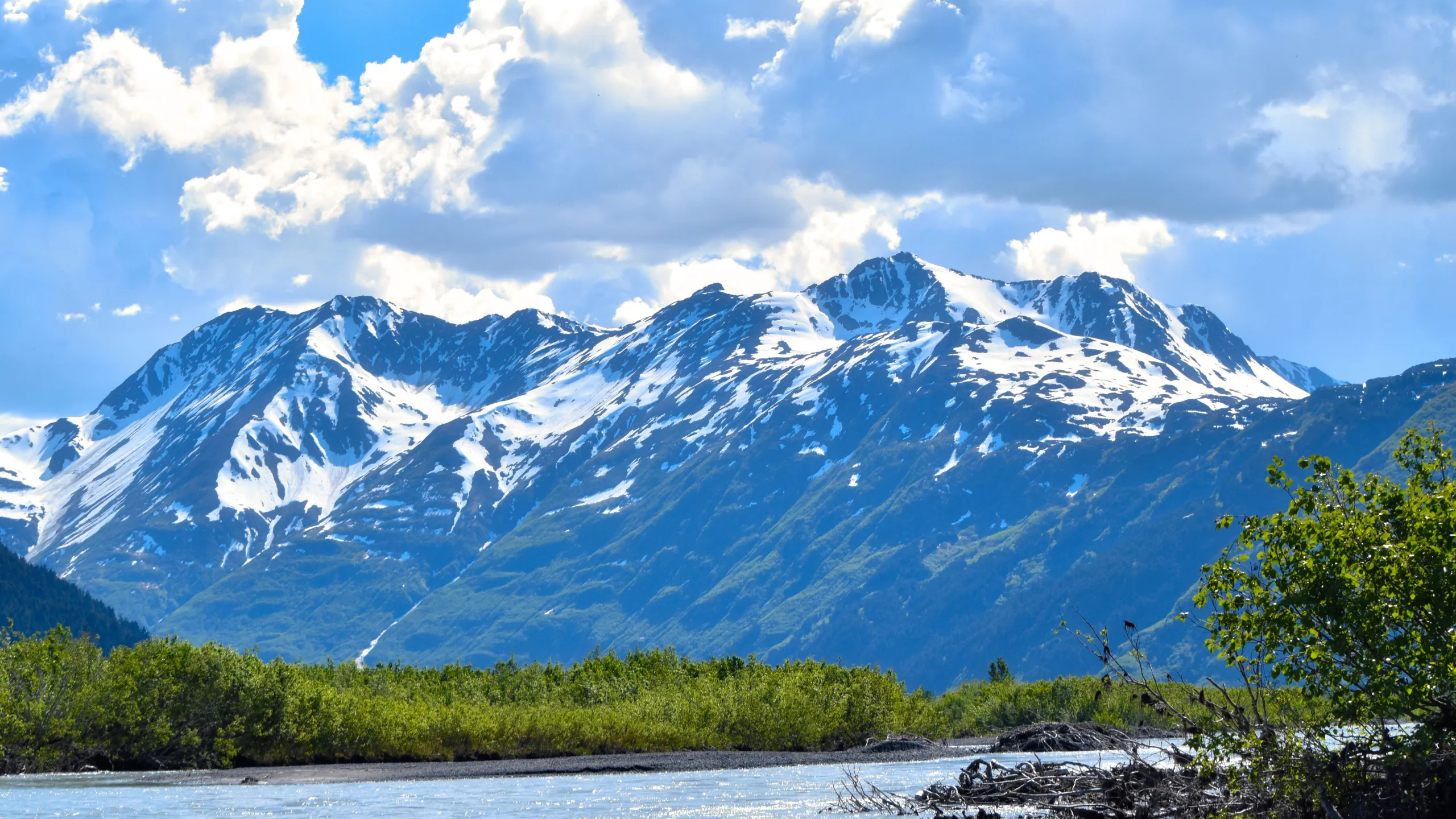 Panoramic view of Alaska's snow-capped mountain ranges