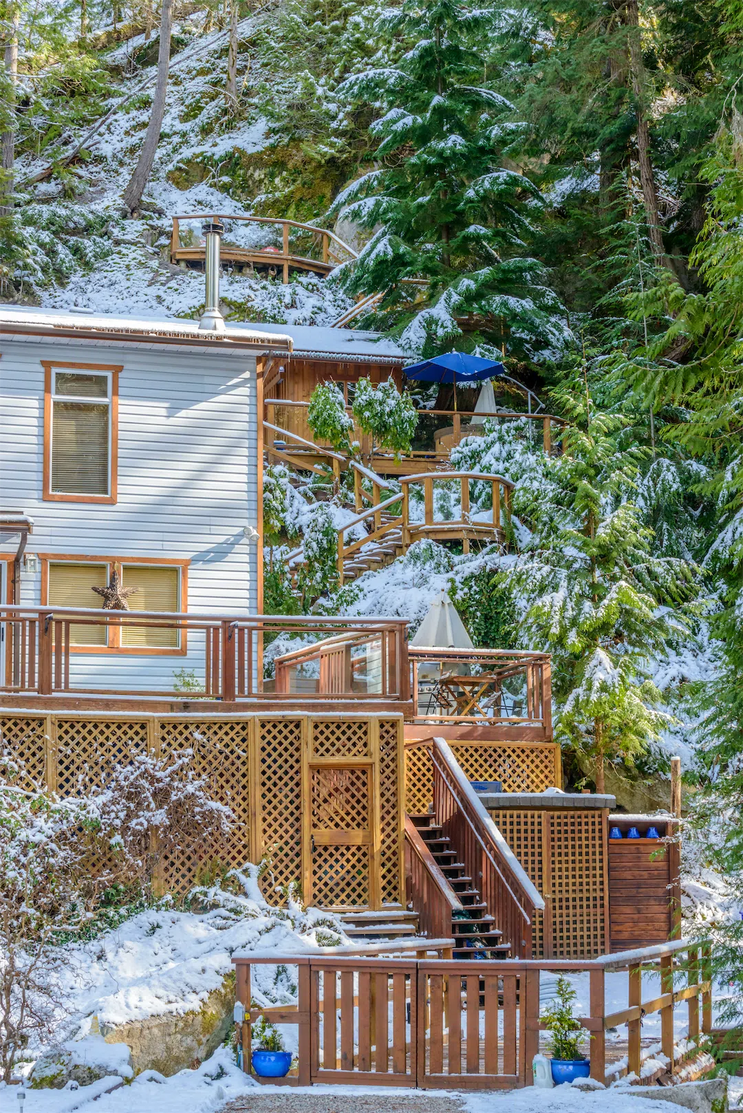 Snow-covered Alaska home in winter requiring professional maintenance