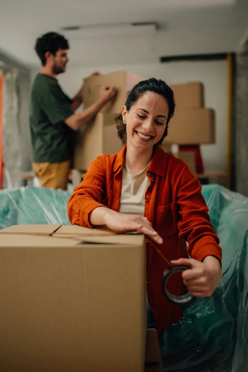 Couple packing and moving into a new home in Alaska