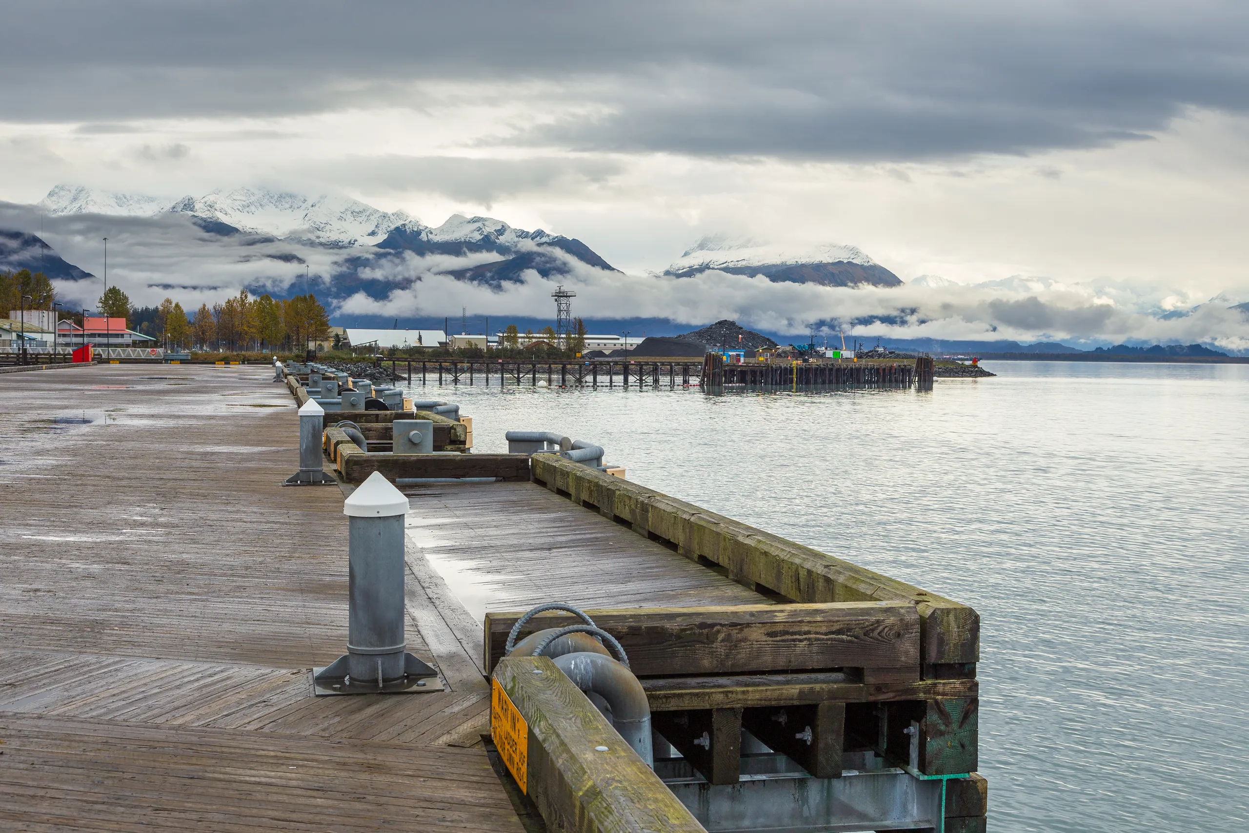 Valdez Alaska harbor with mountains — Alaska property management