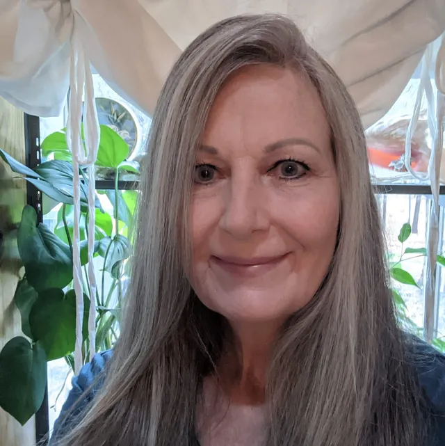 A headshot of Janlyn Rogers, a skincare expert with blonde hair, smiling.